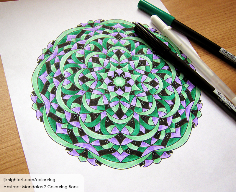 Coloured mandala colouring page in purple, black and green