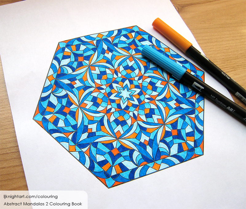 Coloured hexagon mandala colouring page in blue and orange