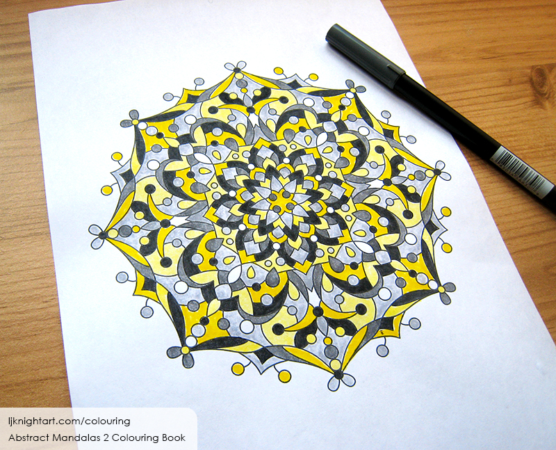 Coloured black and yellow mandala colouring page for adults