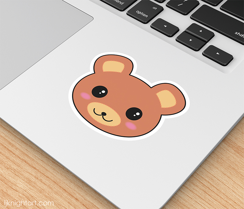 Die cut laptop sticker featuring a cute kawaii brown bear face.